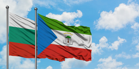 Bulgaria and Equatorial Guinea flag waving in the wind against white cloudy blue sky together. Diplomacy concept, international relations.