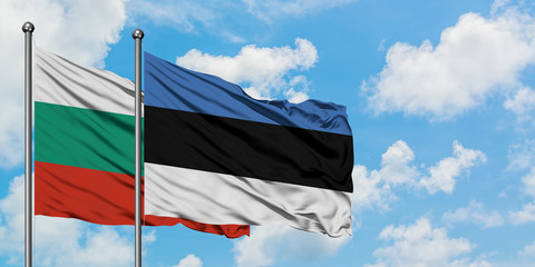 Bulgaria and Estonia flag waving in the wind against white cloudy blue sky together. Diplomacy concept, international relations.