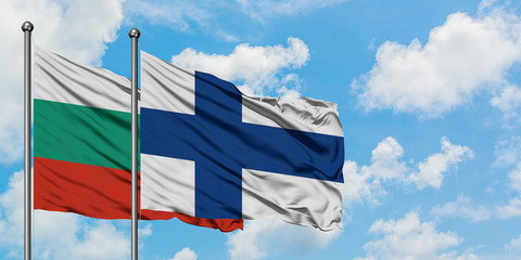 Bulgaria and Finland flag waving in the wind against white cloudy blue sky together. Diplomacy concept, international relations.