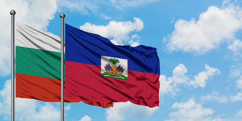 Bulgaria and Haiti flag waving in the wind against white cloudy blue sky together. Diplomacy concept, international relations.