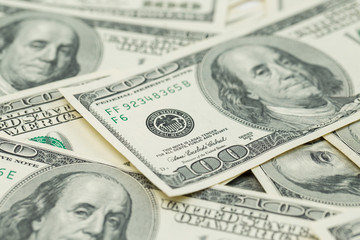 Background of one hundred dollar bills. Benjamin Franklin on USA money banknote