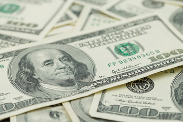 Background of one hundred dollar bills. Benjamin Franklin on USA money banknote