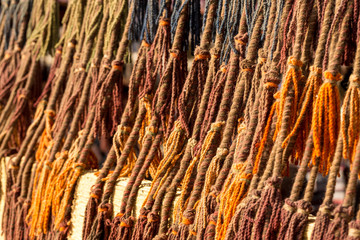 Intricate design on an egyptian or moroccan carpet as a background. Old traditional moroccan colorful carpet with ancient motifs.