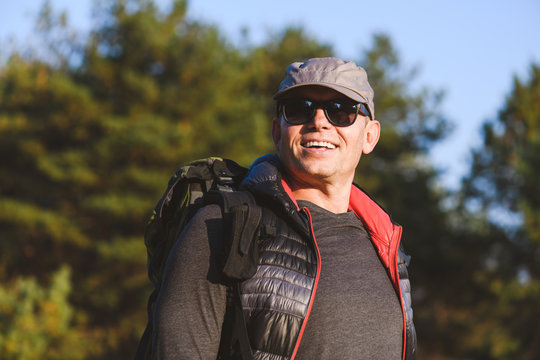 Portrait Of An Elderly Man With A Backpack