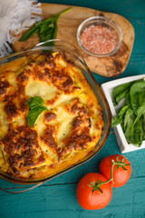 Delicious Lasagna, Italian cuisine. Pasta. Vertical frame with ingredients.