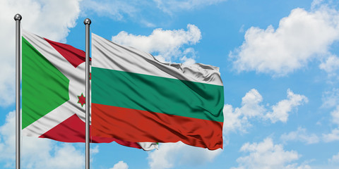 Burundi and Bulgaria flag waving in the wind against white cloudy blue sky together. Diplomacy concept, international relations.