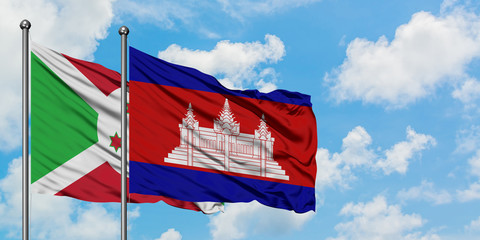 Burundi and Cambodia flag waving in the wind against white cloudy blue sky together. Diplomacy concept, international relations.