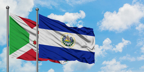 Burundi and El Salvador flag waving in the wind against white cloudy blue sky together. Diplomacy concept, international relations.