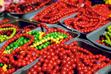 Red beads made of wood. Close-up. Brightly.