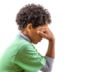 Upset problem child with head in hands , concept for bullying, depression stress or frustration