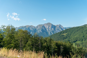 Mountains in the distance green sides under nice blue sky