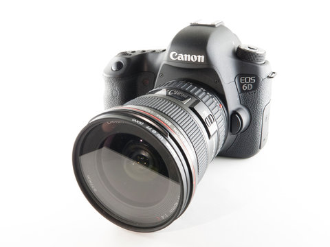 Milan, Italy - January 27, 2019: close up on a Canon EOS 6D DSLR camera resting on white background