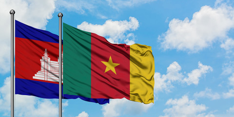 Cambodia and Cameroon flag waving in the wind against white cloudy blue sky together. Diplomacy concept, international relations.