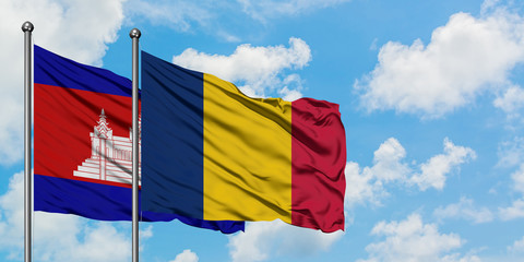 Cambodia and Chad flag waving in the wind against white cloudy blue sky together. Diplomacy concept, international relations.