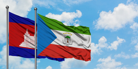 Cambodia and Equatorial Guinea flag waving in the wind against white cloudy blue sky together. Diplomacy concept, international relations.