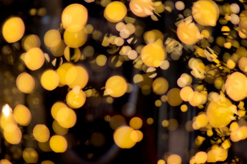 Abstract Christmas golden background. Blurred New year garlands lights.