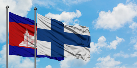 Cambodia and Finland flag waving in the wind against white cloudy blue sky together. Diplomacy concept, international relations.