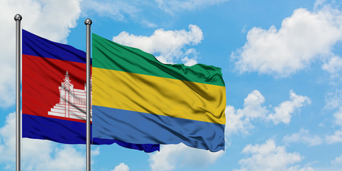Cambodia and Gabon flag waving in the wind against white cloudy blue sky together. Diplomacy concept, international relations.