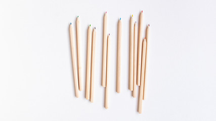 Top view flat lay of a group of wooden pencils on white background. Education concept...