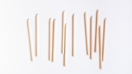 Top view flat lay of a group of wooden pencils on white background. Education concept