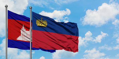 Cambodia and Liechtenstein flag waving in the wind against white cloudy blue sky together. Diplomacy concept, international relations.