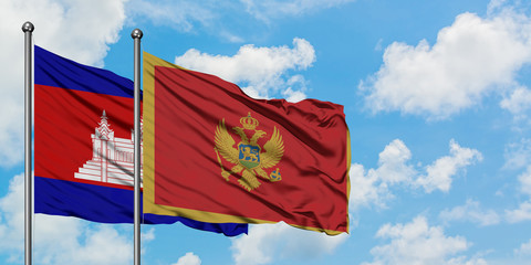 Cambodia and Montenegro flag waving in the wind against white cloudy blue sky together. Diplomacy concept, international relations.