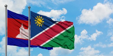 Cambodia and Namibia flag waving in the wind against white cloudy blue sky together. Diplomacy concept, international relations.