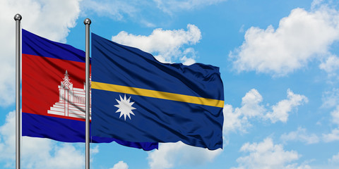 Cambodia and Nauru flag waving in the wind against white cloudy blue sky together. Diplomacy concept, international relations.