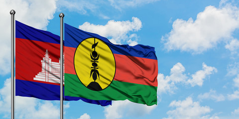 Cambodia and New Caledonia flag waving in the wind against white cloudy blue sky together. Diplomacy concept, international relations.