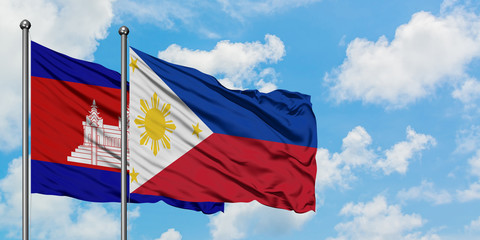 Cambodia and Philippines flag waving in the wind against white cloudy blue sky together. Diplomacy concept, international relations.