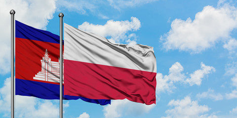 Fototapeta na wymiar Cambodia and Poland flag waving in the wind against white cloudy blue sky together. Diplomacy concept, international relations.