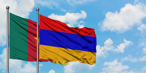 Cameroon and Armenia flag waving in the wind against white cloudy blue sky together. Diplomacy concept, international relations.