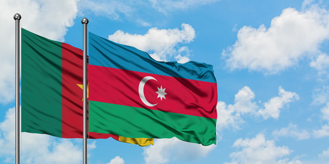 Cameroon and Azerbaijan flag waving in the wind against white cloudy blue sky together. Diplomacy concept, international relations.