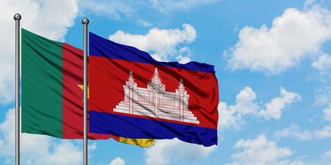 Cameroon and Cambodia flag waving in the wind against white cloudy blue sky together. Diplomacy concept, international relations.