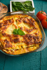 Delicious Lasagna, Italian cuisine. Pasta. Vertical frame with ingredients.