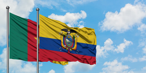 Cameroon and Ecuador flag waving in the wind against white cloudy blue sky together. Diplomacy concept, international relations.