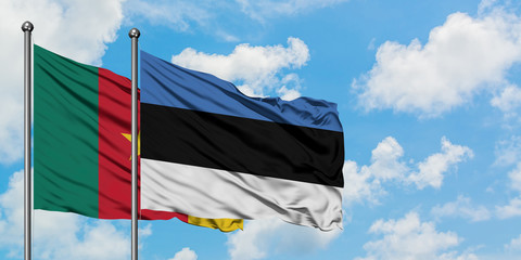 Cameroon and Estonia flag waving in the wind against white cloudy blue sky together. Diplomacy concept, international relations.