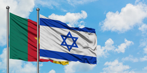 Cameroon and Israel flag waving in the wind against white cloudy blue sky together. Diplomacy concept, international relations.