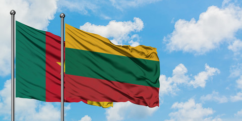 Cameroon and Lithuania flag waving in the wind against white cloudy blue sky together. Diplomacy concept, international relations.