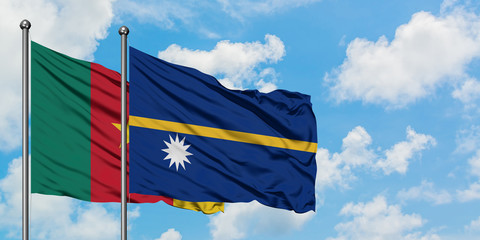 Cameroon and Nauru flag waving in the wind against white cloudy blue sky together. Diplomacy concept, international relations.