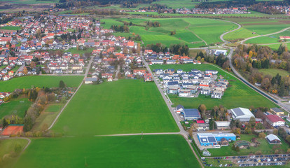Fototapeta na wymiar aerial view of the little town and green fields 