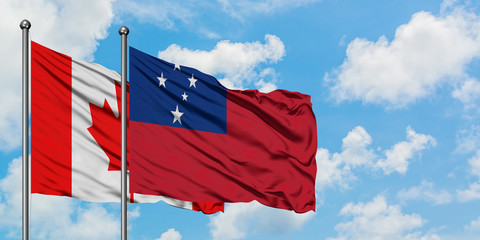 Canada and Samoa flag waving in the wind against white cloudy blue sky together. Diplomacy concept,...