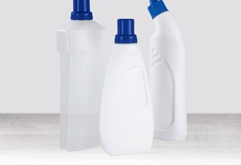 Plastic bottle, cleaning sponge and gloves