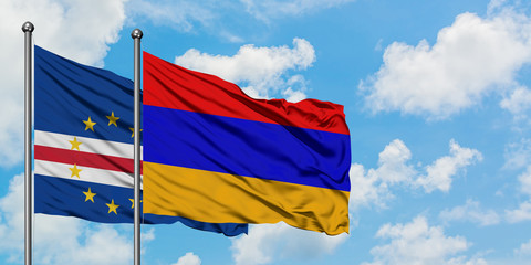 Cape Verde and Armenia flag waving in the wind against white cloudy blue sky together. Diplomacy concept, international relations.