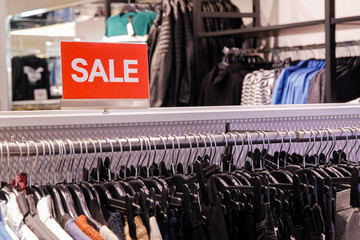 Red sale singboard in a clothing store