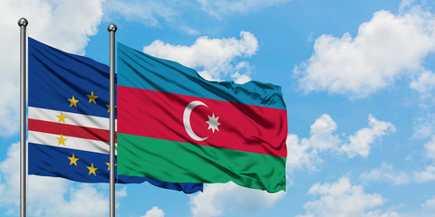 Cape Verde and Azerbaijan flag waving in the wind against white cloudy blue sky together. Diplomacy concept, international relations.