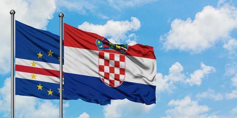 Cape Verde and Croatia flag waving in the wind against white cloudy blue sky together. Diplomacy concept, international relations.