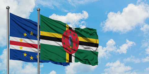 Cape Verde and Dominica flag waving in the wind against white cloudy blue sky together. Diplomacy concept, international relations.