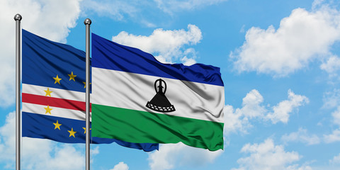 Cape Verde and Lesotho flag waving in the wind against white cloudy blue sky together. Diplomacy concept, international relations.