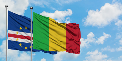 Cape Verde and Mali flag waving in the wind against white cloudy blue sky together. Diplomacy concept, international relations.
